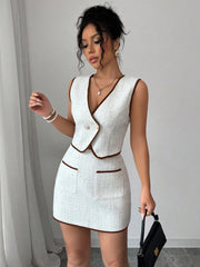 Completo tweed top smanicato con bordi a contrasto